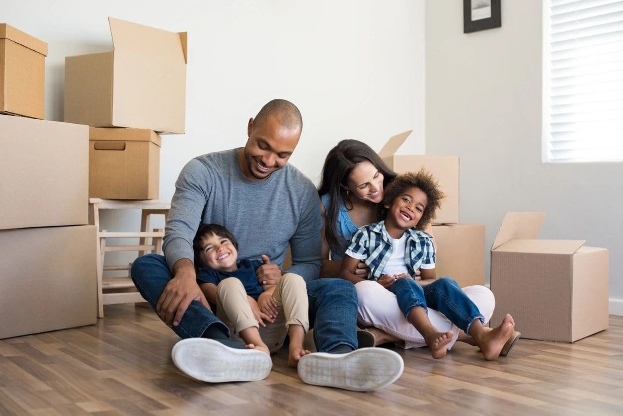 A man and two children sitting on the floor